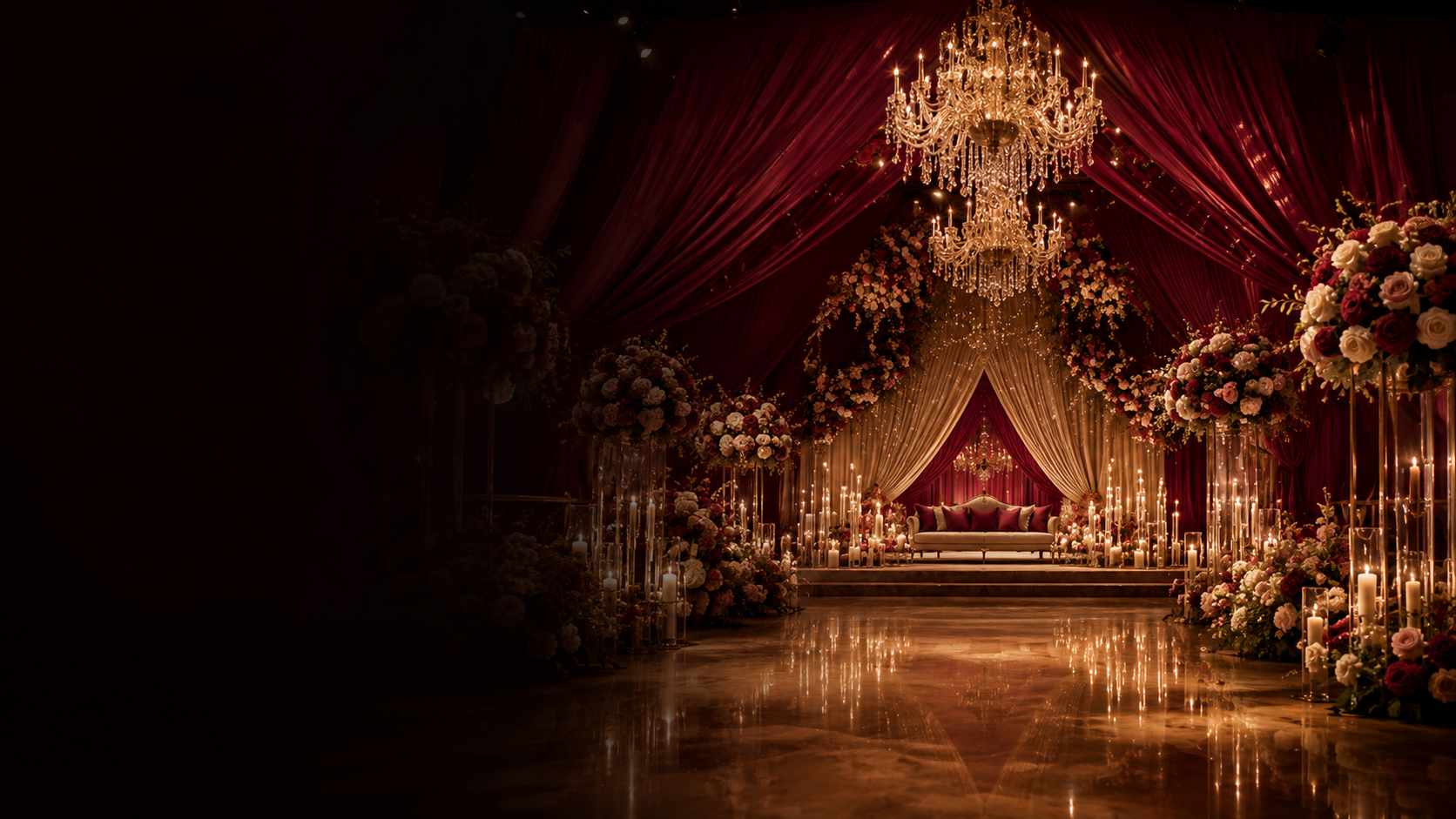 Luxury wedding stage with chandeliers and floral installations by Evently
